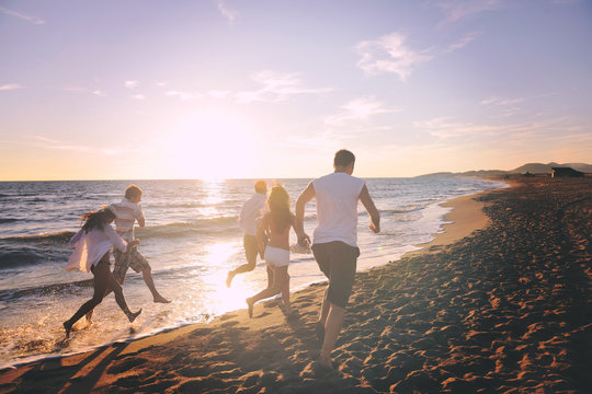 people group running on the beach