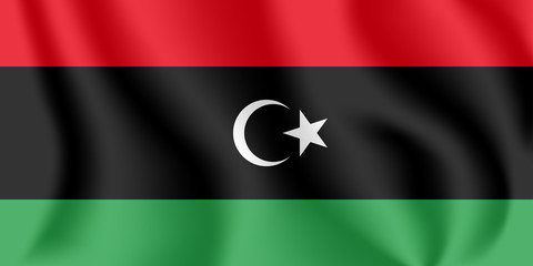 Flag of Libya. Realistic waving flag of State of Libya. Fabric textured flowing flag of Libya.
