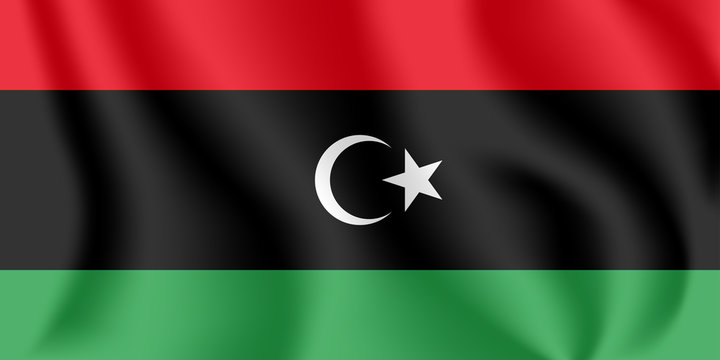 Flag of Libya. Realistic waving flag of State of Libya. Fabric textured flowing flag of Libya.