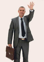confident businessman making a welcoming hand gesture