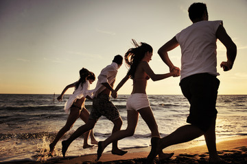 people group running on the beach