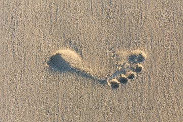 Foot imprint on sand