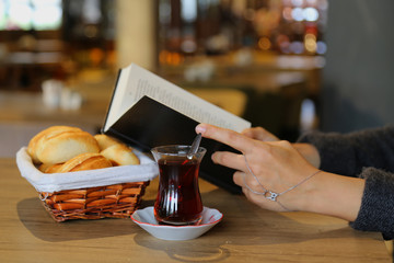 tea concept. the girl drink tea in the cafe