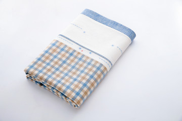 blue and white checkered tablecloth on white background