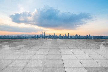Fototapeta premium empty concrete floor and modern buildings in midtown of singapore in blue cloud sky