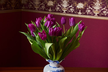 Lilac Tulips. Bud, petals, bouquet/Lilac tulips in a decorative vase stand on a table. Russia, Moscow, holiday, gift, mood, nature, flower, plant, bouquet, macro
