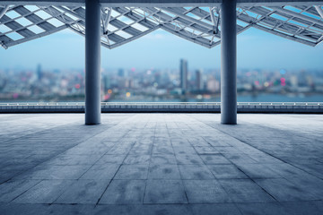 cityscape of modern city at dawn from empty floor