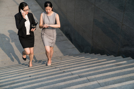 busy businesswomen walking upstairs.