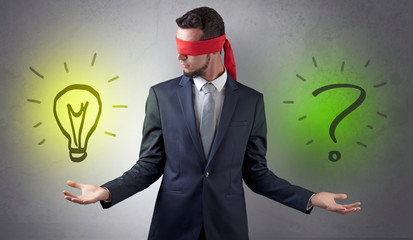 Businessman with idea versus question concept