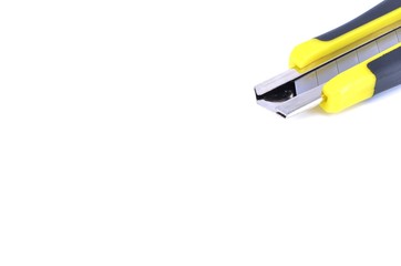 Yellow snap-off blade knife on white background.