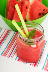 Watermelon smoothie with mint on white background