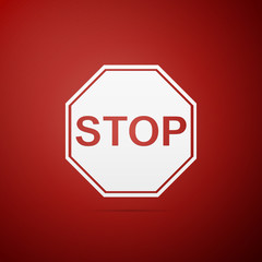 Stop sign icon isolated on red background. Traffic regulatory warning stop symbol. Flat design. Vector Illustration