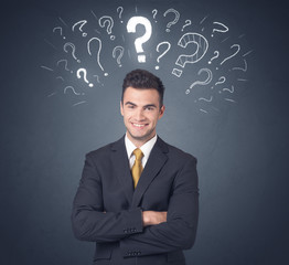 Businessman with question marks
