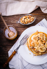Pancakes with banana, walnuts and honey