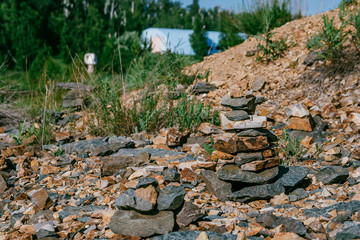built small pyramids of stones for nature in the summer