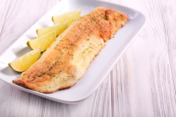 Fried grass carp fish with lime