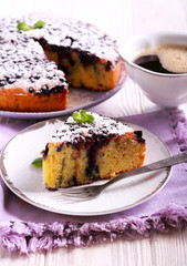 Blueberry cornmeal cake with icing sugar on top