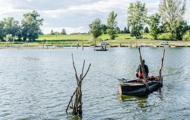Novi Sad, Serbia - June 20, 2015: Fisherman on the artificial lake near the town of Novi Sad 