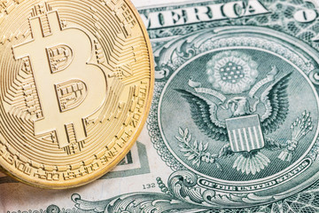 Close-up of a golden bitcoin on dollar bill with Great Seal of the United States background