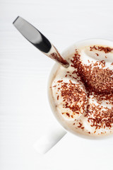 Hot chocolate and marshmallow sprinkled with chocolate chips.