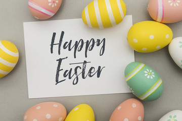 Colourful easter eggs with a handwritten easter message