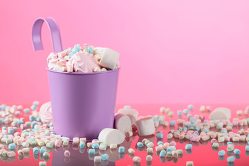 Violet pail with various marshmallows.