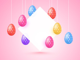 Hanging colorful painted eggs and space for your text. Happy Easter Concept.