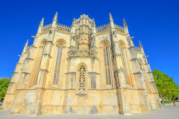 Fototapeta na wymiar Popular Batalha Monastery, one of best examples of Gothic architecture in Portugal, mixed with Manueline style. Dominican convent of Saint Mary of the Victory in city of Batalha, Unesco Heritage.