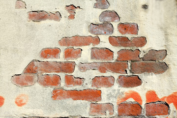 alte Ziegelsteinmauer, bröckelnder Putz