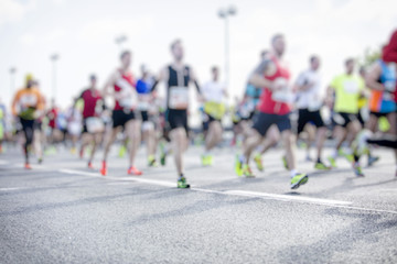 silhouette of people running marathon