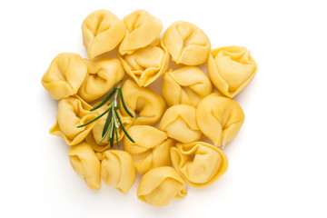 Raw homemade pasta,tortellini with herbs.