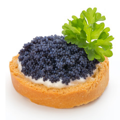 Canapes with black sturgeon caviar and  parsley. Isolated on the white background.