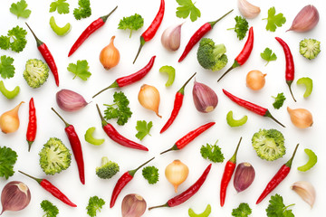 Vegetable and spices isolated on white background, top view. Wallpaper abstract composition of vegetables.