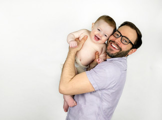 Fototapeta premium Young father holding his baby son