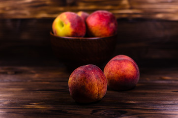 Fresh ripe peaches on wooden table
