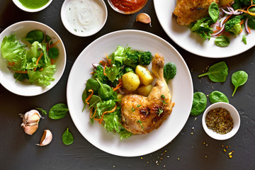 Chicken leg with potato and green salad