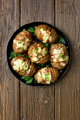 Baked potatoes with bacon, green onion and cheese