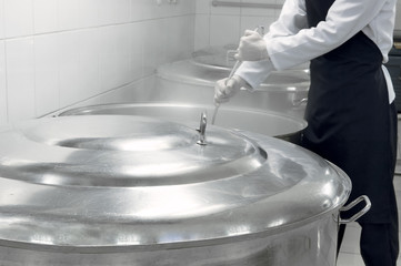 great food in a saucepan while stirring the food factory
