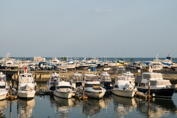 Fototapeta na wymiar boats harbor - motorboats docked at port