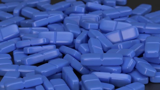 Blaue Tabletten - Pillen fallen auf den Boden
