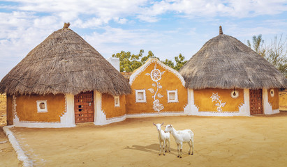 Rajasthan village near Thar desert Jaisalmer with mud huts with painted walls