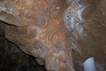 Stalactites and stalagmites inside a cave © E-lona