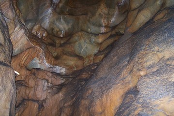 Stalactites and stalagmites inside a cave © E-lona