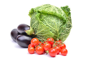 Savoy cabbage, cherry tomatoes  and eggplants on a white background