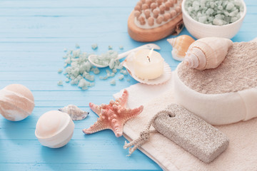 Spa concept with candles on blue wooden background