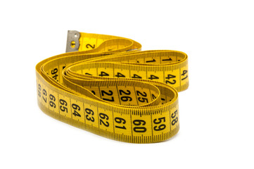 Yellow tape measure on the white