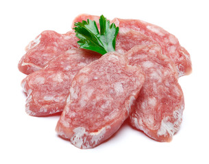 Dried sliced organic salami sausage on white background
