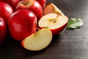 Naklejka na ściany i meble Fresh ripe red apples on wooden background, closeup