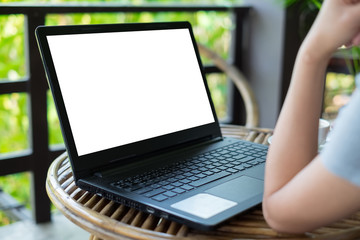 Rear view of a creative female freelancer sitting front laptop computer with blank copy space screen for your information, young business woman work on net-book during breakfast in coffee modern shop