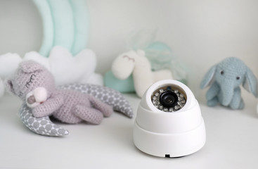 Baby monitor and toys on table
